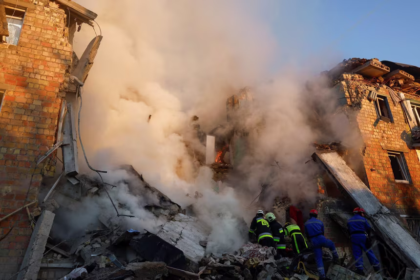 Rescuers race to reach victims as Russian strikes pound Kyiv, killing at least eight, including a child