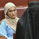 Australia senator suspended after burka stunt in parliament