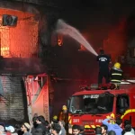 At least six killed in Pakistan as fire rips through Karachi shopping mall